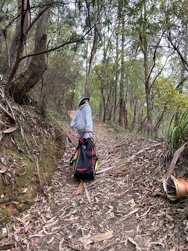 Maxy dragging the kit bag up a steep path
